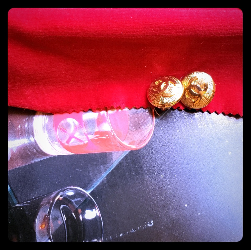 Authentic Chanel  logo gold tone clip earrings